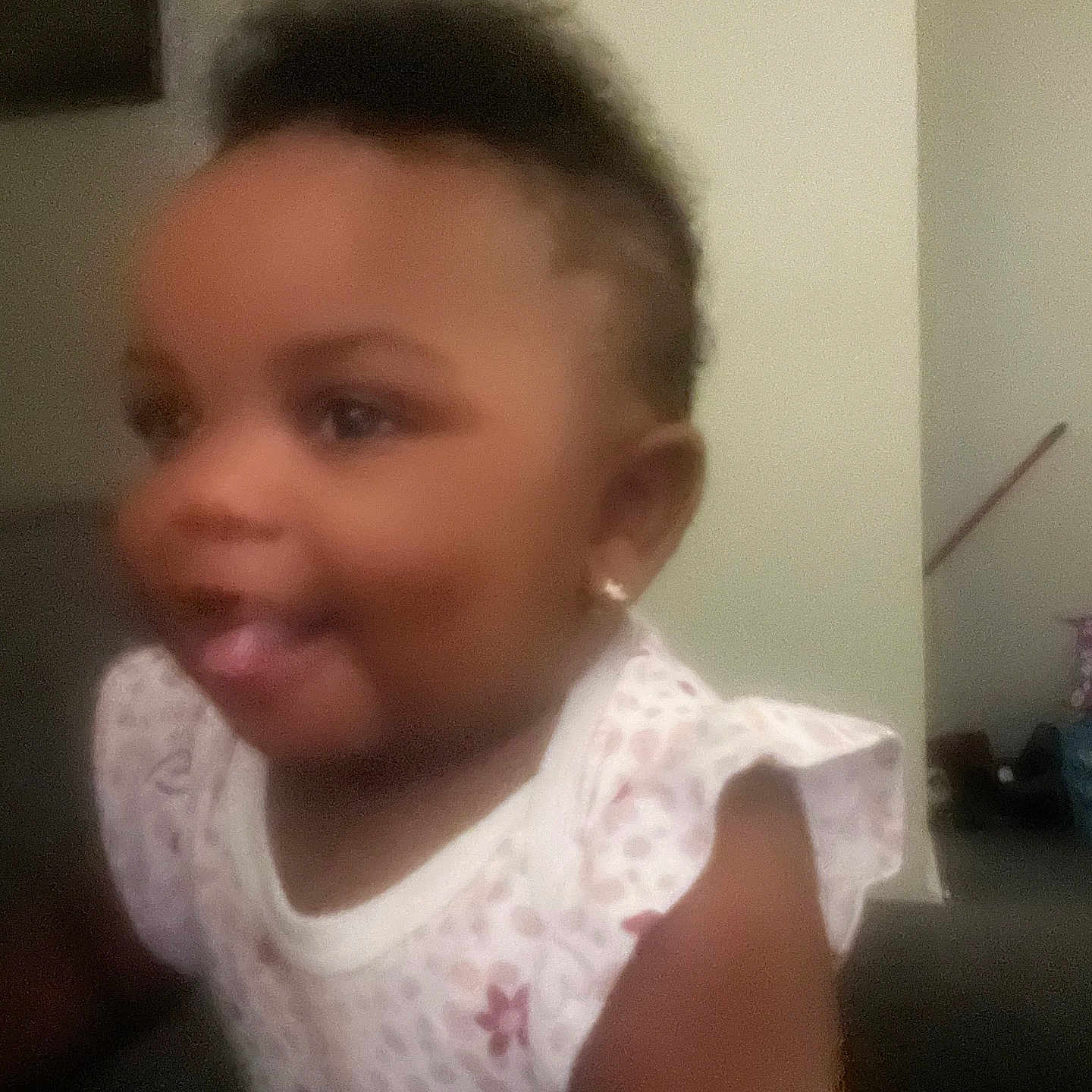 Breya is registered to the contest to win money with this photo: baby, blurry, child, clothing, cute, earrings, expression, face, hair, human, indoor, pattern, person, portrait, skin, smiling, toddler, tongue, white, young