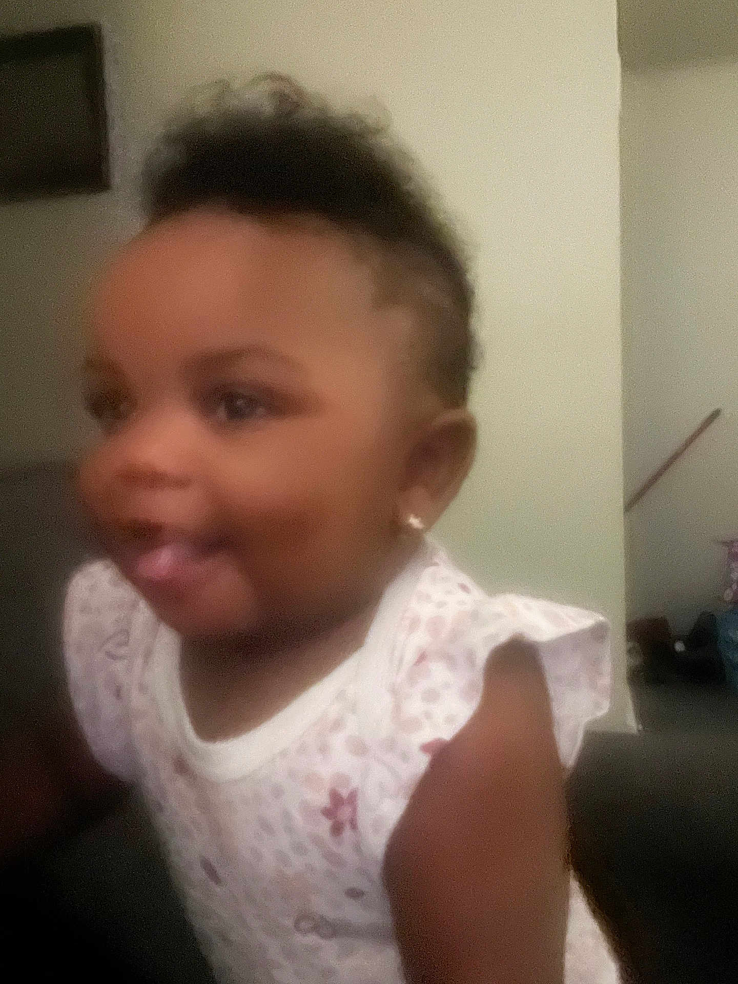 Breya is registered to the contest to win money with this photo: baby, blurry, child, clothing, cute, earrings, expression, face, hair, human, indoor, pattern, person, portrait, skin, smiling, toddler, tongue, white, young