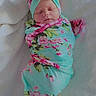 Kalena joined the competition — help win amazing prizes! newborn, baby, sleeping, swaddled, infant, portrait, floral, headband, bow, blanket, pink, turquoise, indoors, bed, soft, peaceful, face, closed_eyes, textile, photography