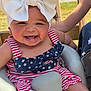 Ocean joined the competition — help win amazing prizes! baby, smiling, headband, bow, outdoor, seat, happy, child, apparel, person, face, red_stripes, blue_stars, summer, cute, infant, portrait, sunlight, wooden_fence, baby_seat