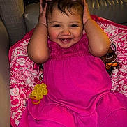 Yerailis joined the competition — help win amazing prizes! toddler, child, pink_dress, sunglasses, smiling, toy, blanket, indoor, cute, happy, playful, person, face, seated, colorful, cartoon, clothing, young_child, portrait, cozy