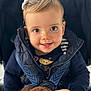 Inès a rejoint le concours — aidez-le/la à gagner de superbes lots ! toddler, child, baby, smile, face, hair_bow, stroller, jacket, toy, stuffed_animal, plush, hand, closeup, portrait, happy, young_child, cute, indoor, person, clothing