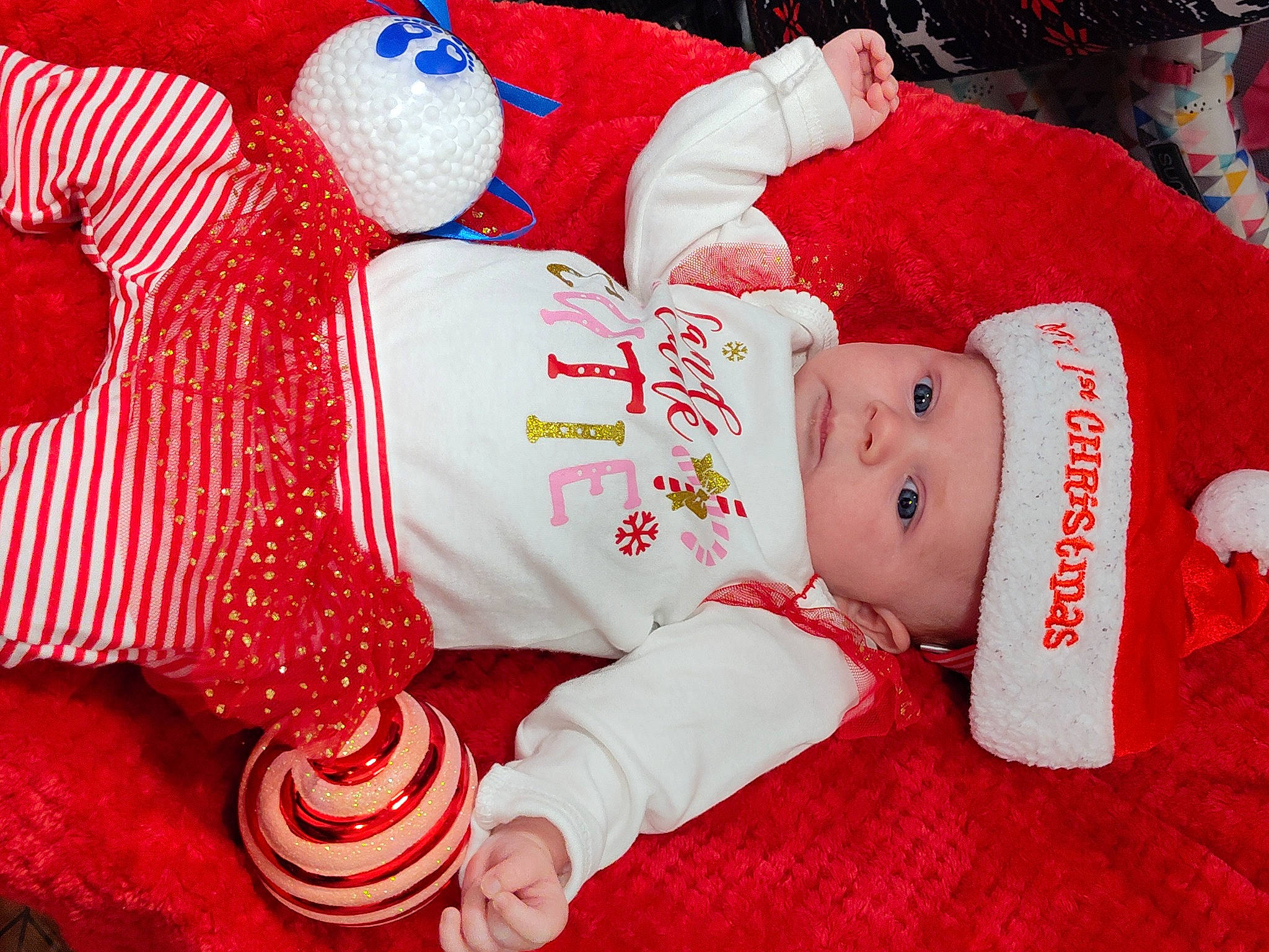 Jolie joined the competition — help win amazing prizes! baby, baby_sleeping, baby_toddler_clothing, carmine, child, comfort, costume_hat, event, happy, hat, head, headgear, headwear, holiday, human_body, lap, person, pink, red, sleeve