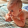 Kannon joined the competition — help win amazing prizes! baby, infant, child, portrait, lying_down, bed, bedspread, plaid, home, bedroom, face, eyes, smiling, curious, hands, fist, skin, hair, indoor, social_media