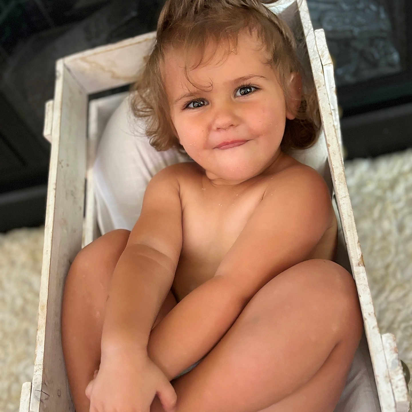 Raelynn Marie Lyon joined the competition — help win amazing prizes! baby, blonde, bodypart, box, clothing, crate, dress, face, finger, furniture, hair, hand, happy, head, person, photography, portrait, sitting, smile, wood