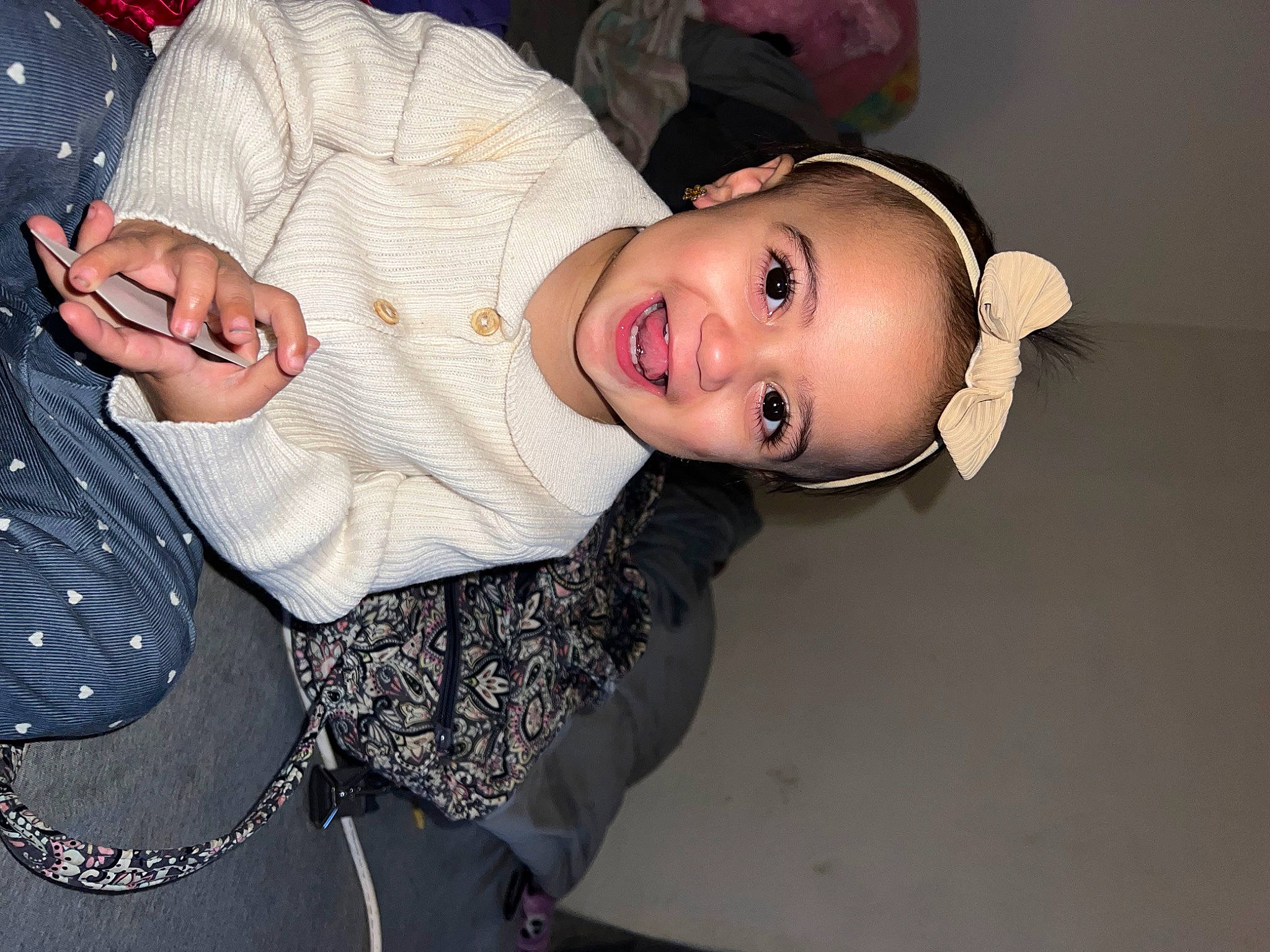 Journey is registered to the contest to win money with this photo: baby_toddler_clothing, cheek, chest, child, eyelash, fashion_accessory, fashion_design, flash_photography, happy, hat, human_body, joy, lip, pattern, person, pink, skin, sleeve, smile, toddler