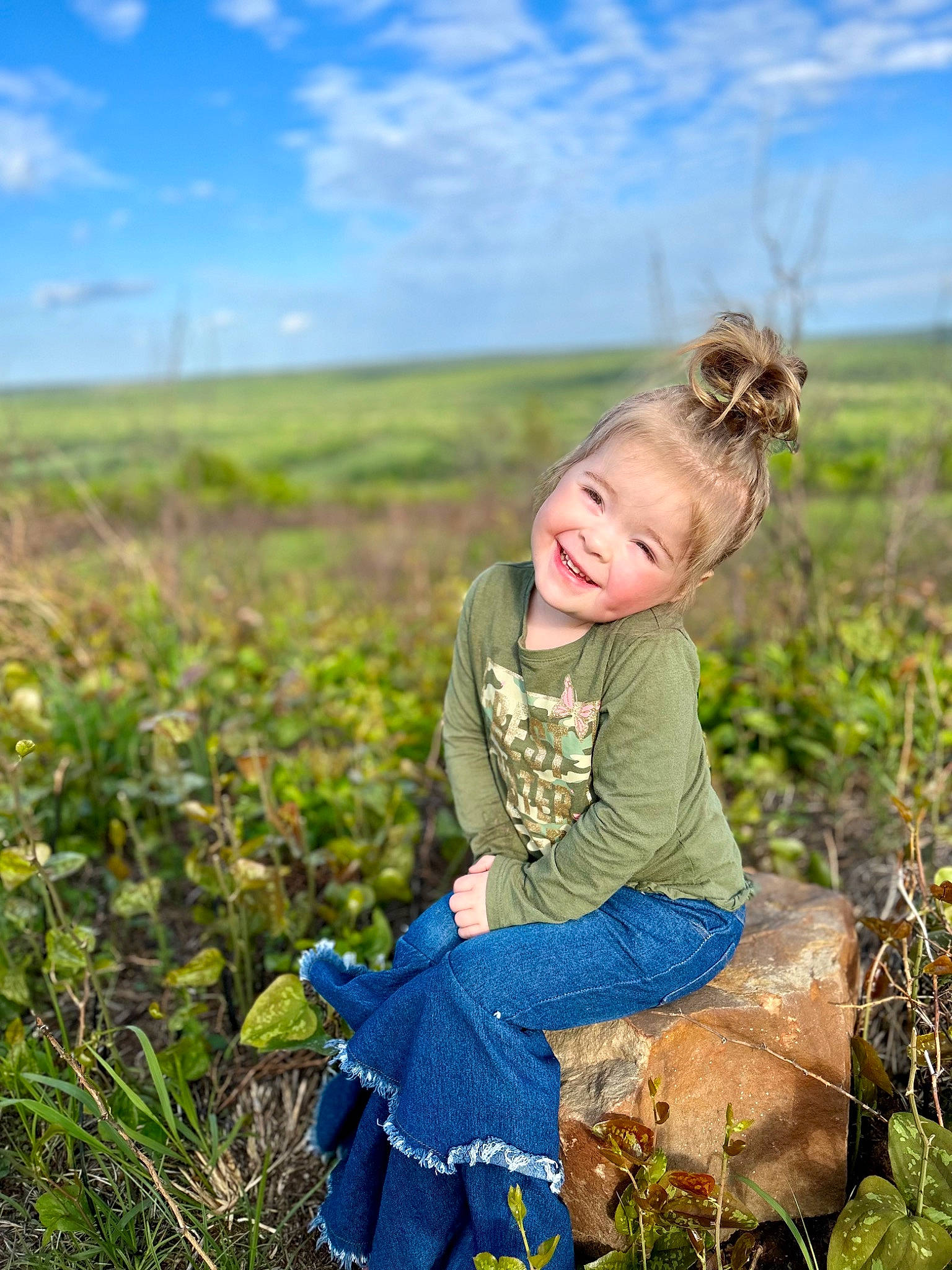 Beverly joined the competition — help win amazing prizes! agriculture, baby_toddler_clothing, blond, blue, child, cloud, grass, grass_family, grassland, happy, joy, landscape, meadow, nature, people_in_nature, person, plant, prairie, rural_area, sky