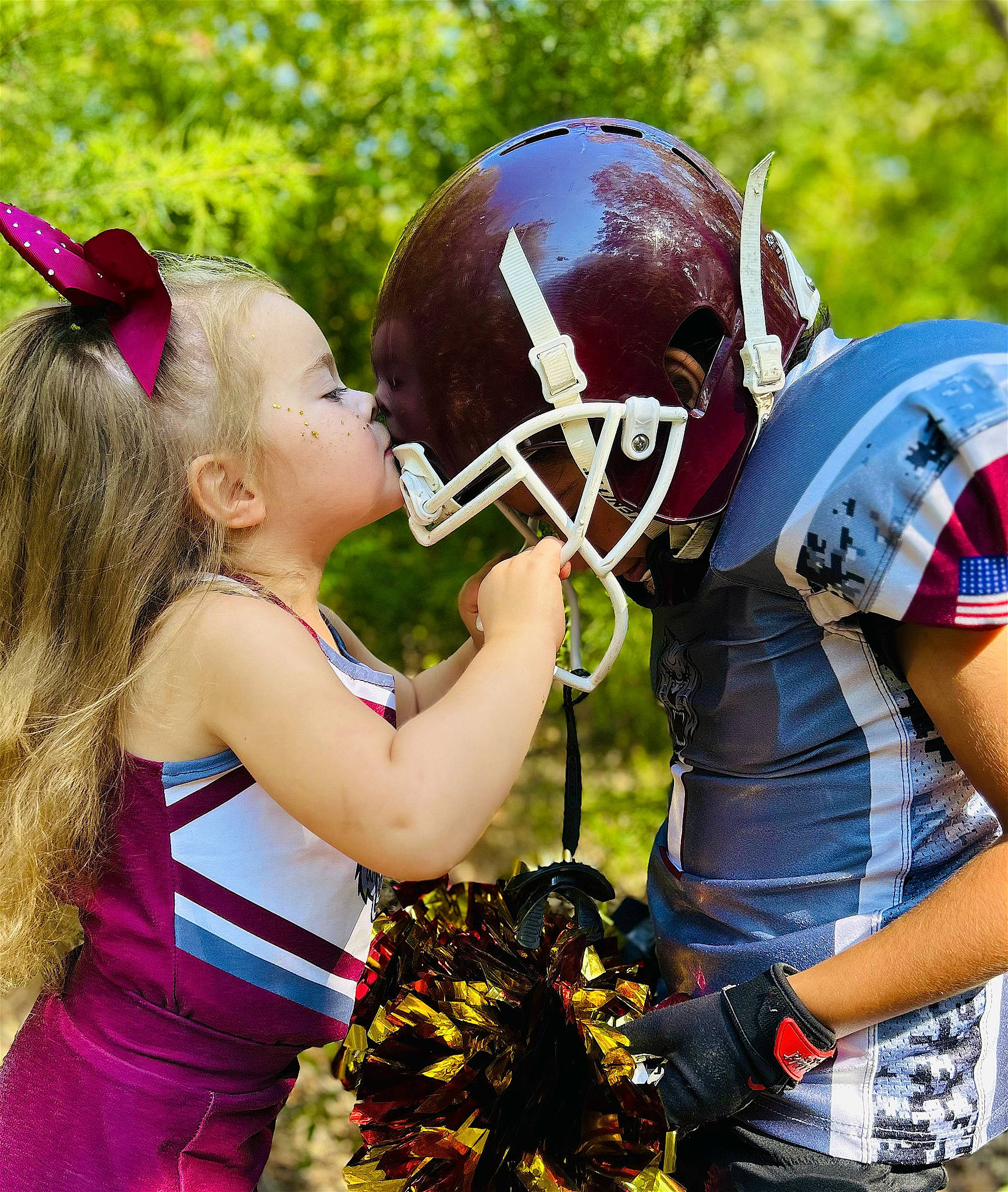 Beverly is registered to the contest to win money with this photo: american_football, child, competition_event, face_mask, football_equipment, football_gear, football_helmet, fun, gesture, glove, grass, gridiron_football, happy, helmet, person, personal_protective_equipment, player, sports_equipment, sports_gear, sprint_football