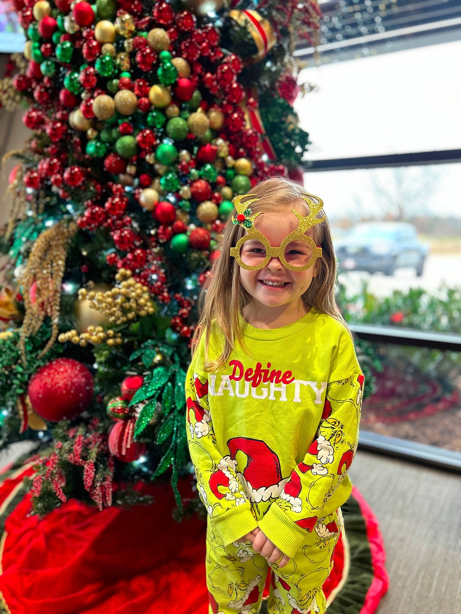 Beverly is registered to the contest to win money with this photo: christmas, christmas_decoration, christmas_ornament, christmas_tree, conifer, event, evergreen, fun, happy, holiday, holiday_ornament, joy, ornament, person, plant, sleeve, smile, snapshot, standing, toddler
