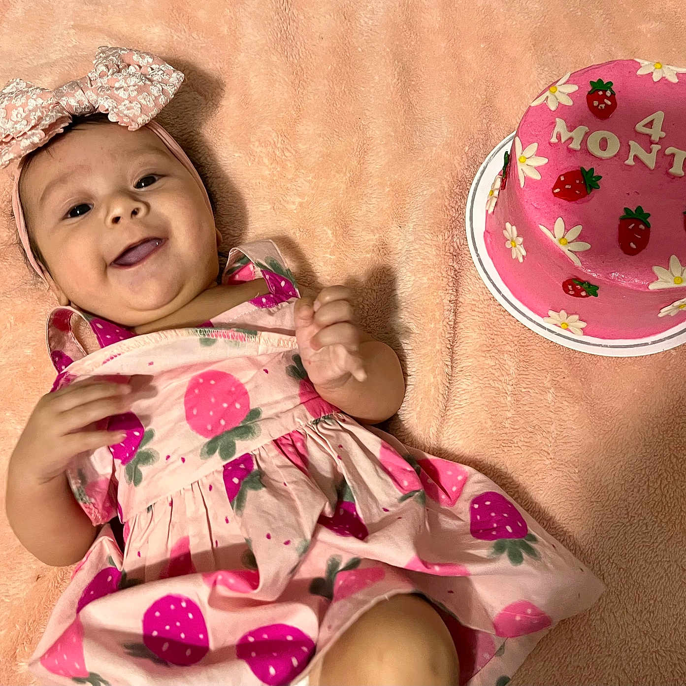 Sophia is registered to the contest to win money with this photo: baby, babylaughing, birthdaycake, cake, clothing, cream, dessert, dress, face, food, happy, hat, head, icing, people, person, photography, portrait, smile, tape