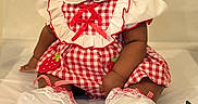 Clover joined the competition — help win amazing prizes! baby, baby_girl, child, clothing, cute, dress, fabric, footwear, gingham, happy, headwear, indoor, infant, person, portrait, red_bow, sitting, smile, strawberries, white_socks