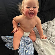 Colton joined the competition — help win amazing prizes! baby, child, diaper, smile, happy, blanket, couch, indoor, sock, toddler, face, skin, furniture, cute, cheerful, sitting, expression, cozy, plush, young