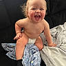 baby, child, diaper, smile, happy, blanket, couch, indoor, sock, toddler, face, skin, furniture, cute, cheerful, sitting, expression, cozy, plush, young