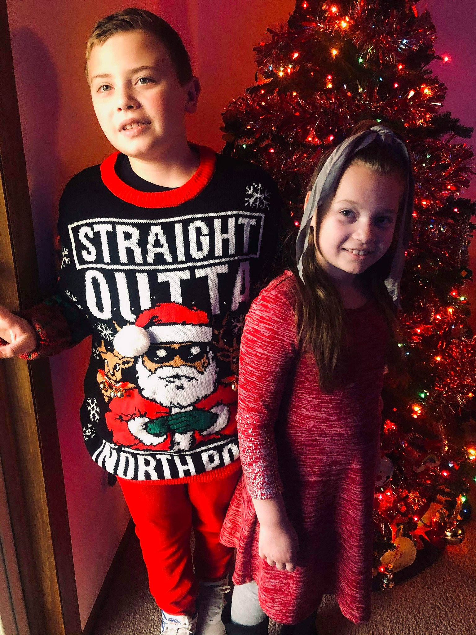 Seleyna joined the competition — help win amazing prizes! baby_toddler_clothing, beauty, black, christmas, christmas_decoration, christmas_ornament, christmas_tree, face, facial_expression, fun, happy, holiday, joy, organ, person, red, sleeve, smile, standing, t_shirt