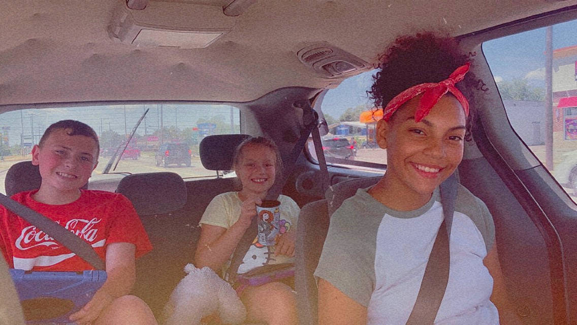 Seleyna joined the competition — help win amazing prizes! automotive_design, automotive_exterior, car, car_seat, event, eyewear, family_car, fun, happy, head_restraint, headwear, joy, leisure, motor_vehicle, passenger, person, shorts, smile, t_shirt, travel