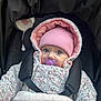 baby, pacifier, pink_hat, snowsuit, floral_pattern, stroller, blanket, blue_eyes, face, child, winter_clothing, cute, infant, seated, bundle_up, outdoor, portrait, baby_gear, warm, cozy