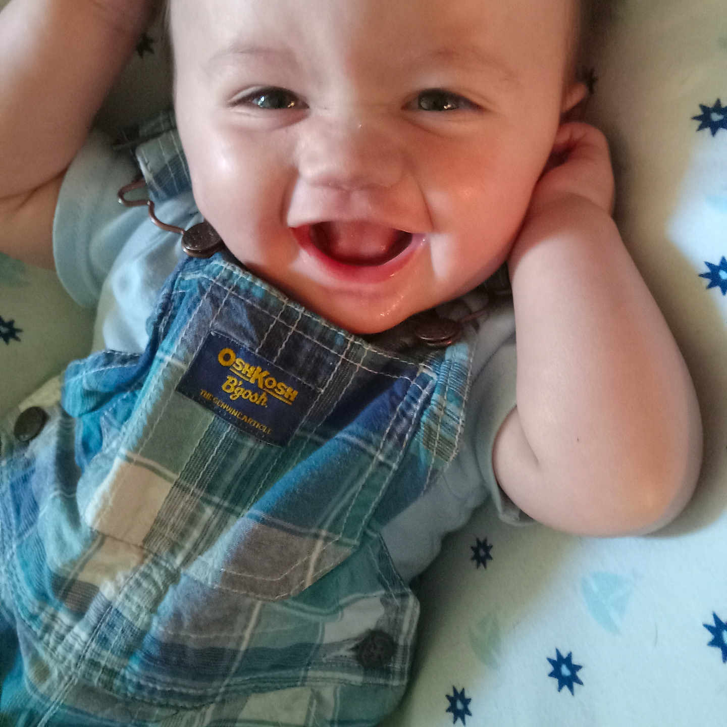 Emanuel is registered to the contest to win money with this photo: baby, babylaughing, bodypart, clothing, face, finger, hand, happy, head, jeans, mouth, pants, person, photography, portrait, shirt, shorts, smile, t_shirt, tartan
