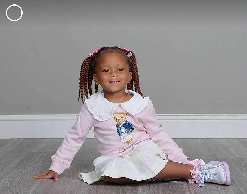 Amira joined the competition — help win amazing prizes! baby_toddler_clothing, child, event, fashion_accessory, fashion_design, flash_photography, flooring, fun, hair, happy, headband, jewellery, joy, magenta, outerwear, person, pink, sitting, sleeve, smile