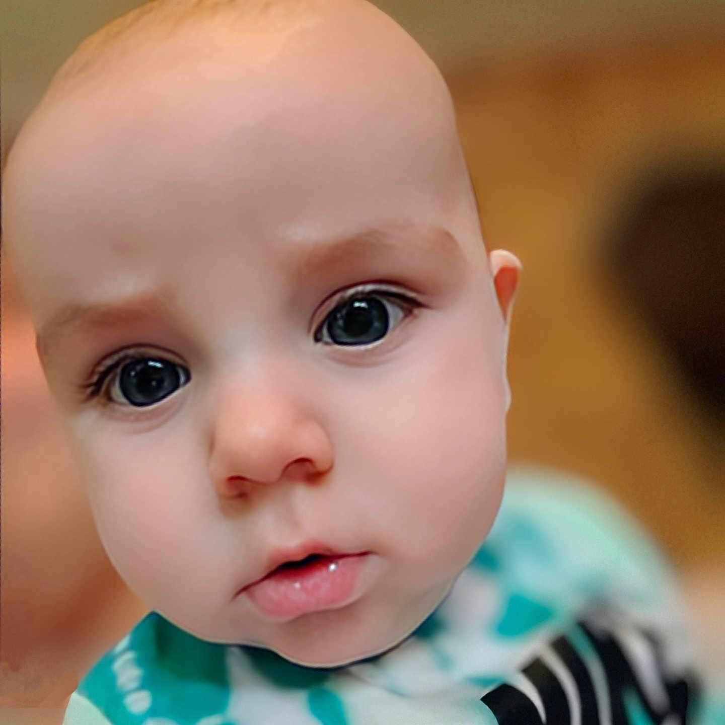 Liam joined the competition — help win amazing prizes! apparel, baby, child, close_up, curious, cute, expression, eyes, face, head, human, indoors, infant, person, portrait, shirt, skin, small, soft_focus, young