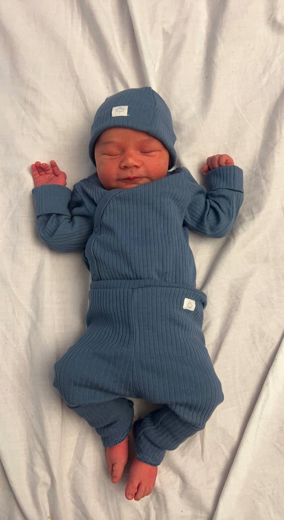 Jaxson is registered to the contest to win money with this photo: baby, baby_toddler_clothing, baseball_cap, cap, cheek, child, comfort, freezing, headwear, hood, jacket, knit_cap, outerwear, pattern, person, skin, sleeve, snow, textile, toddler