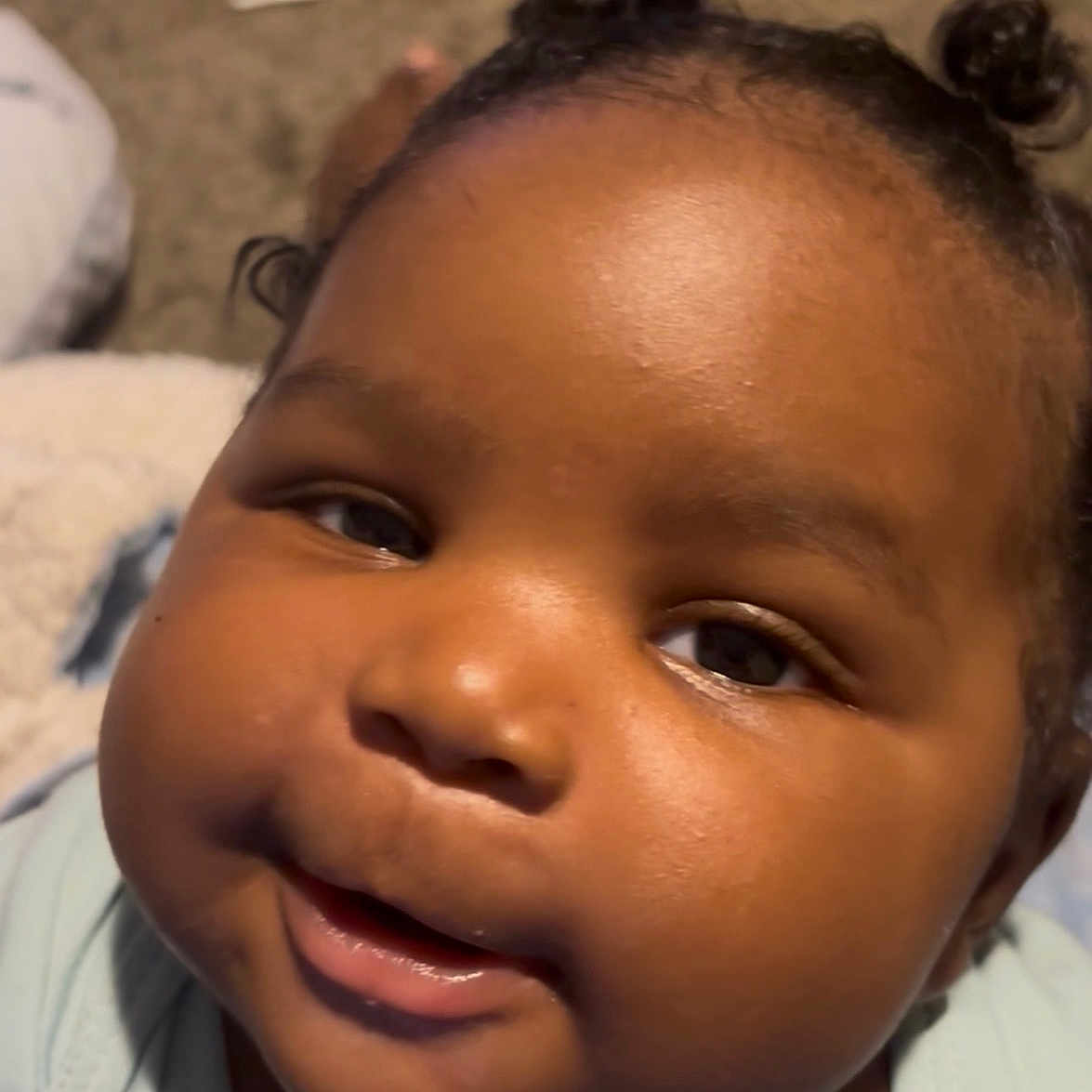 Kyson D Freeman is registered to the contest to win money with this photo: baby, carpet, child, chubby_cheeks, closeup, clothing, curious, curly_hair, cute, expression, eyes, face, indoor, infant, looking_up, mouth, person, portrait, skin, young_child