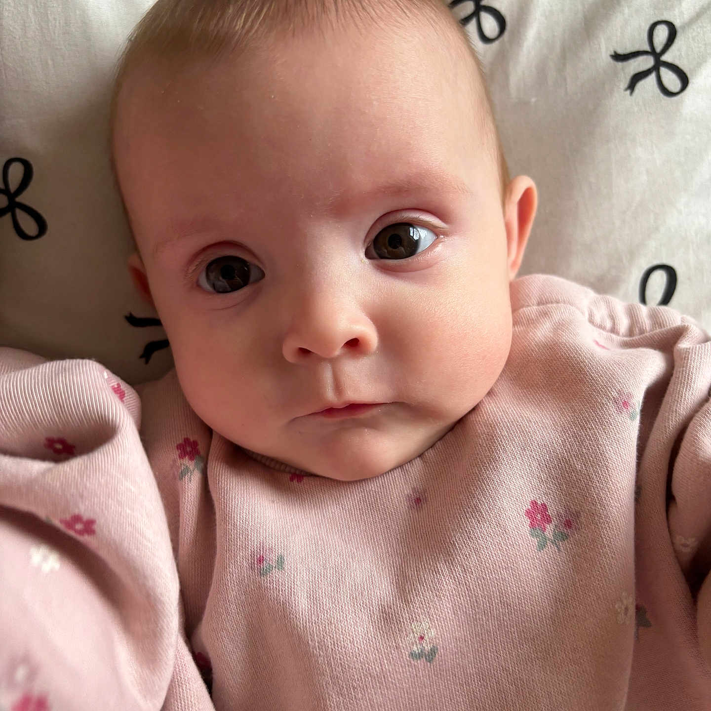 Thea is registered to the contest to win money with this photo: baby, blanket, bodypart, cushion, ear, face, finger, frown, hand, happy, head, newborn, pattern, person, photography, portrait, quilt, sad, skin, smile