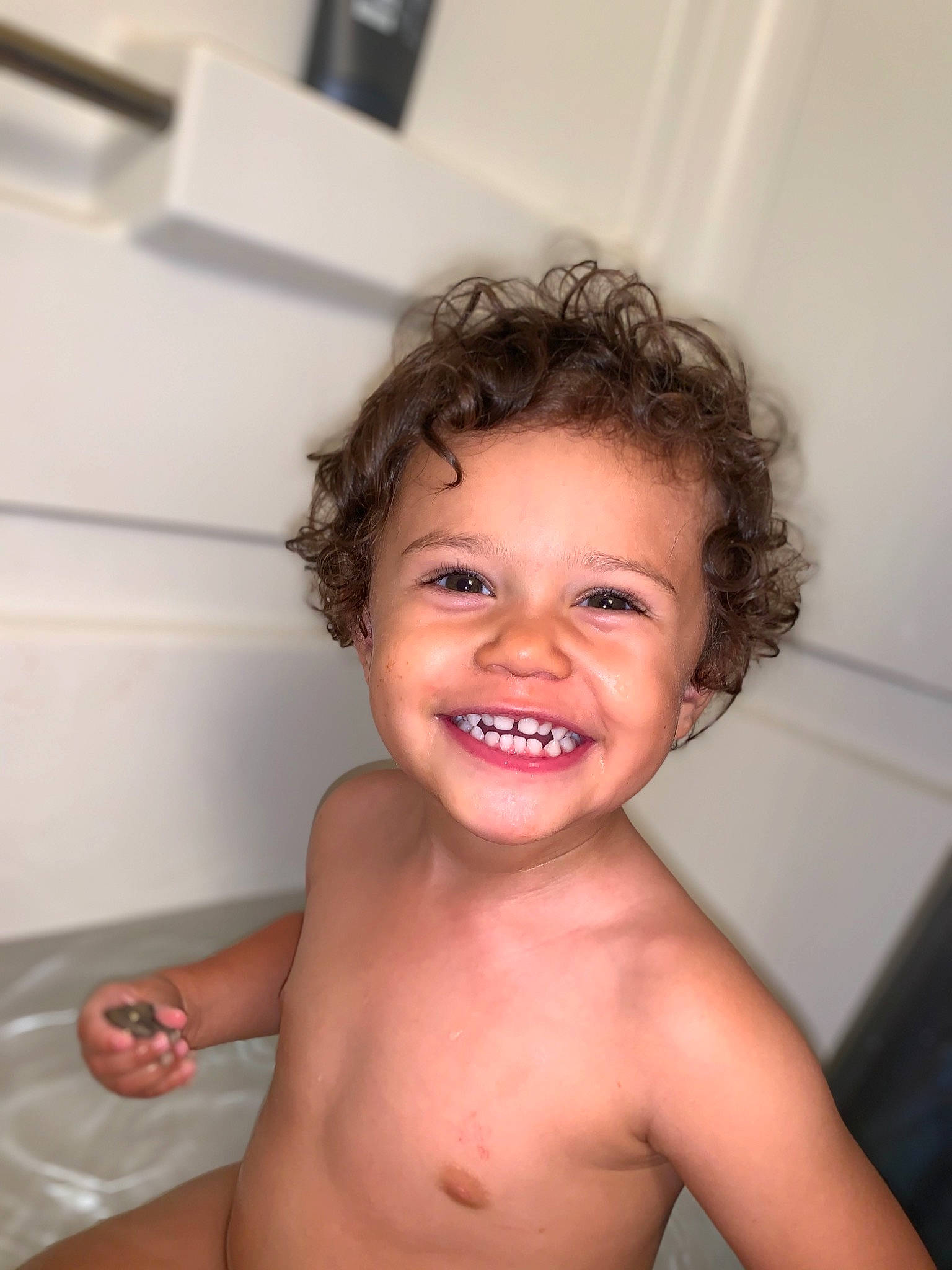 Nate is registered to the contest to win money with this photo: bathing, cheek, child, chin, eyebrow, face, facial_expression, forehead, fun, hair, hairstyle, head, joy, lip, mouth, neck, nose, person, skin, smile