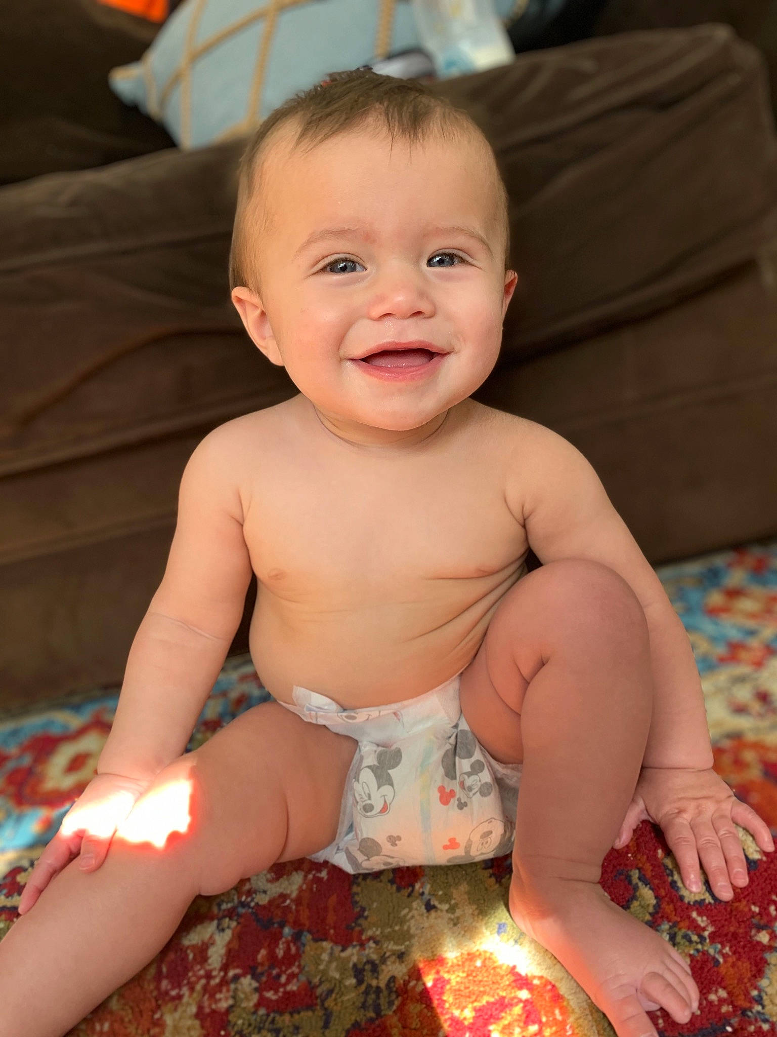 Asher is registered to the contest to win money with this photo: baby, cheek, child, eye, face, finger, head, iris, joy, person, sitting, skin, smile, toddler