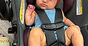 Ayannah joined the competition — help win amazing prizes! baby, child, car_seat, headband, red_bow, blue_outfit, straps, infant, foot, hand, face, expression, seatbelt, indoor, floor, footwear, person, cute, portrait, safety