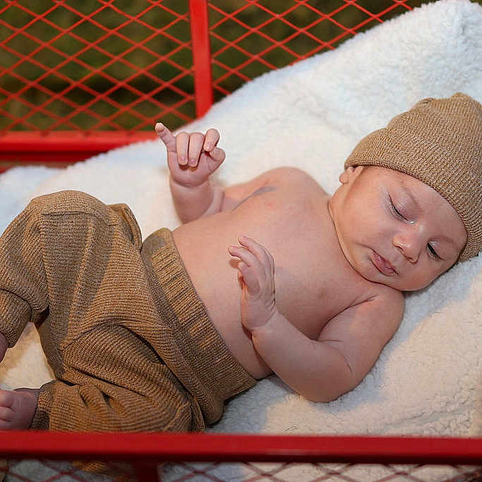 Enzo Sklar joined the competition — help win amazing prizes! autumn, baby, blanket, child, cozy, cute, foot, hand, hat, indoors, infant, knitwear, peaceful, portrait, pumpkin, red_cart, resting, skin, sleeping, soft