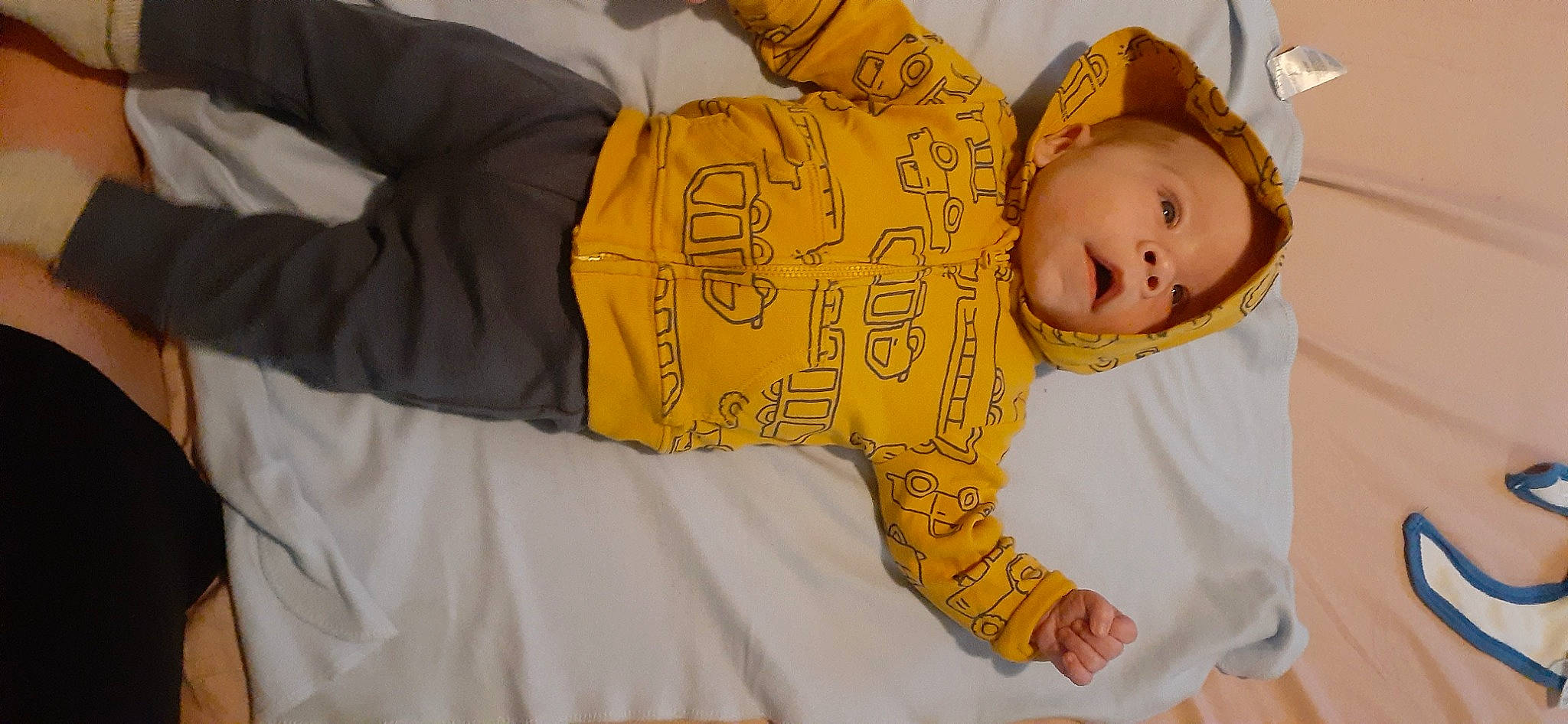 Christopher Jr. is registered to the contest to win money with this photo: baby, baby_products, baby_safety, baby_sleeping, baby_toddler_clothing, cheek, child, comfort, fun, happy, human_body, linens, nightwear, outerwear, pattern, person, room, sitting, sleeve, sock