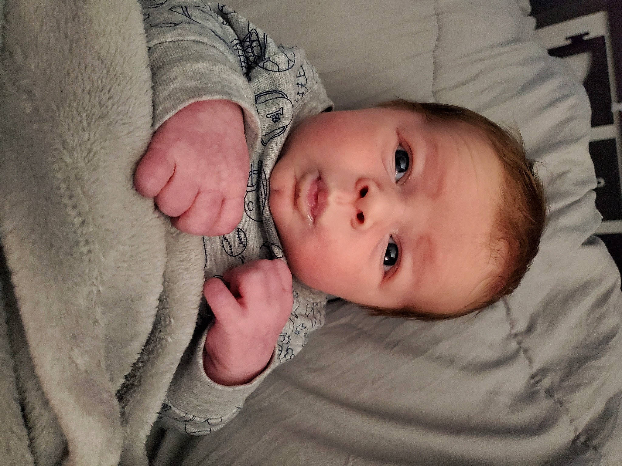 Kaden is registered to the contest to win money with this photo: arm, baby, cheek, child, chin, eye, face, finger, forehead, hand, head, human, iris, lip, mouth, nose, organ, person, photograph, skin