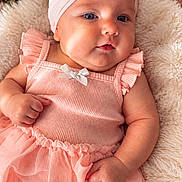 Elyanna joined the competition — help win amazing prizes! baby, infant, child, portrait, lying_down, smiling, pink_outfit, hair_bow, headband, dress, ruffles, blanket, fluffy_blanket, flowers, roses, nursery, indoor, close_up, cute, photography