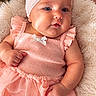 baby, infant, child, portrait, lying_down, smiling, pink_outfit, hair_bow, headband, dress, ruffles, blanket, fluffy_blanket, flowers, roses, nursery, indoor, close_up, cute, photography