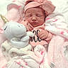 newborn, baby, sleeping, blanket, pink, headband, bow, plush_toy, unicorn, soft_toy, cozy, cute, infant, clothing, wrapped, peaceful, portrait, child, resting, indoors