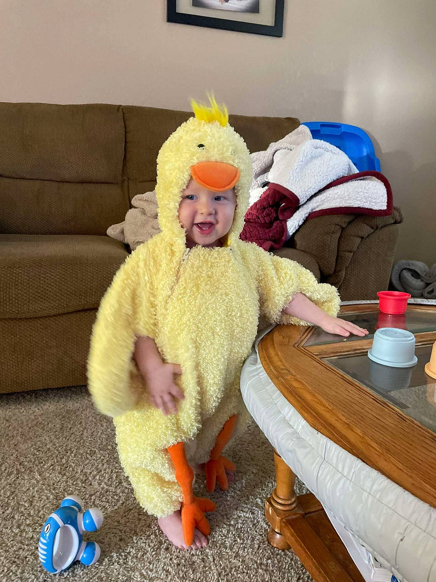 Bryce joined the competition — help win amazing prizes! chair, comfort, costume_hat, couch, desk, event, flooring, fur, furniture, hat, headgear, headwear, lap, person, picture_frame, room, santa_claus, sitting, smile, table