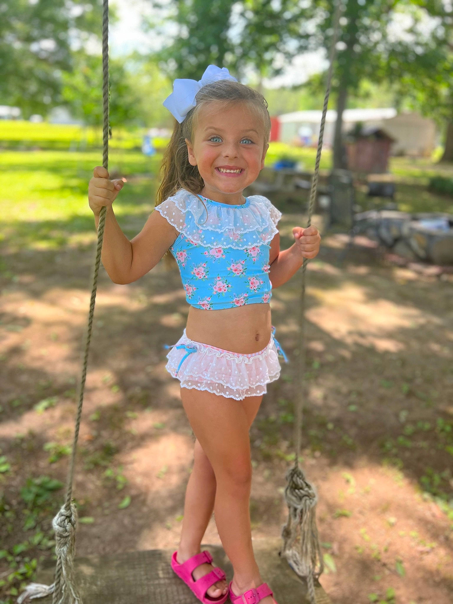 Kenli Pennington is registered to the contest to win money with this photo: blond, electric_blue, grass, hairstyle, happy, human_settlement, joy, leisure, people_in_nature, person, pink, plant, recreation, shorts, shoulder, smile, summer, t_shirt, thigh, toddler