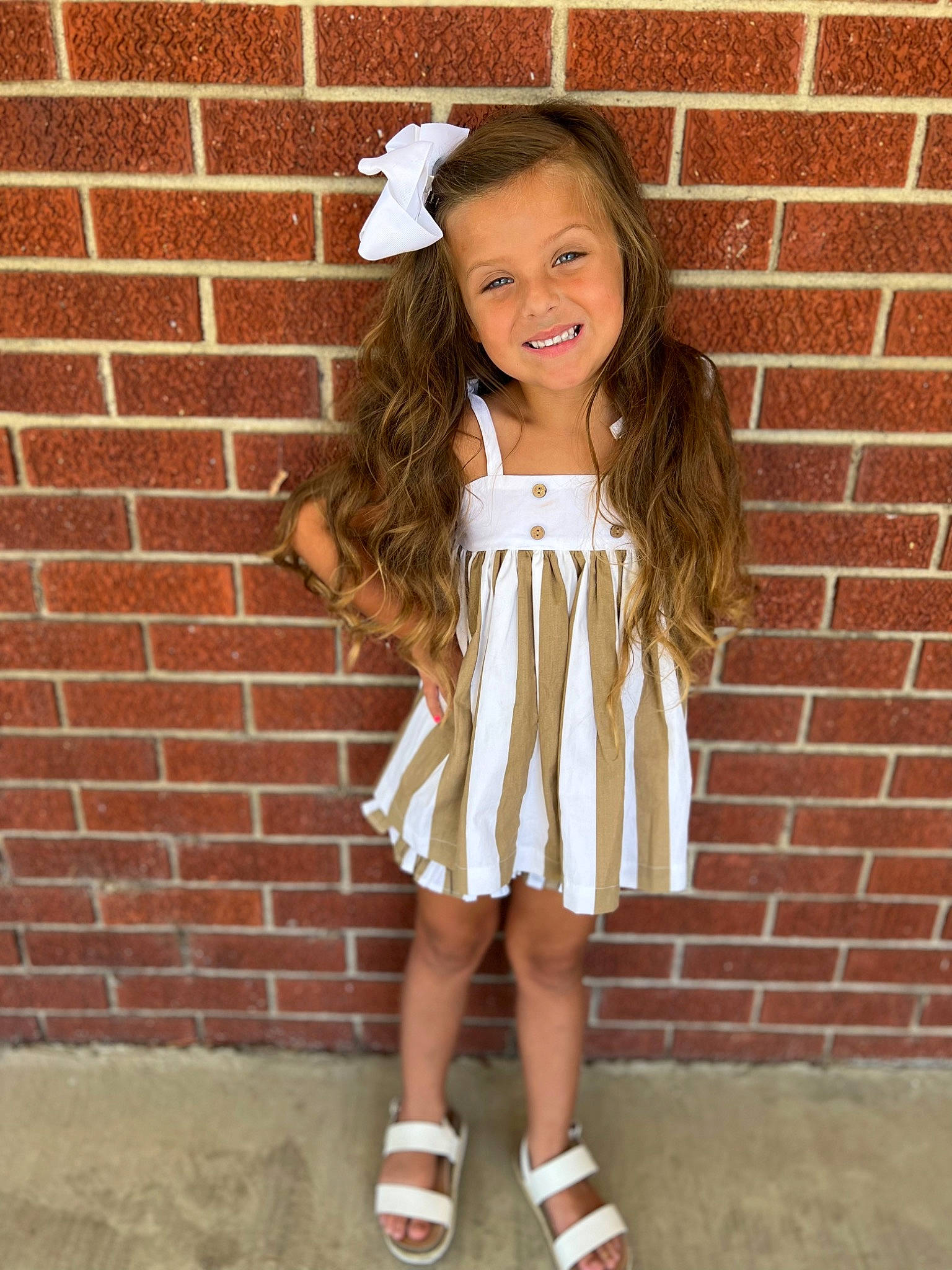 Kenli Pennington joined the competition — help win amazing prizes! baby_toddler_clothing, bangs, brick, brickwork, day_dress, fashion_design, fawn, hair, joy, knee, lip, neck, outerwear, person, pink, shoulder, sleeve, smile, t_shirt, thigh