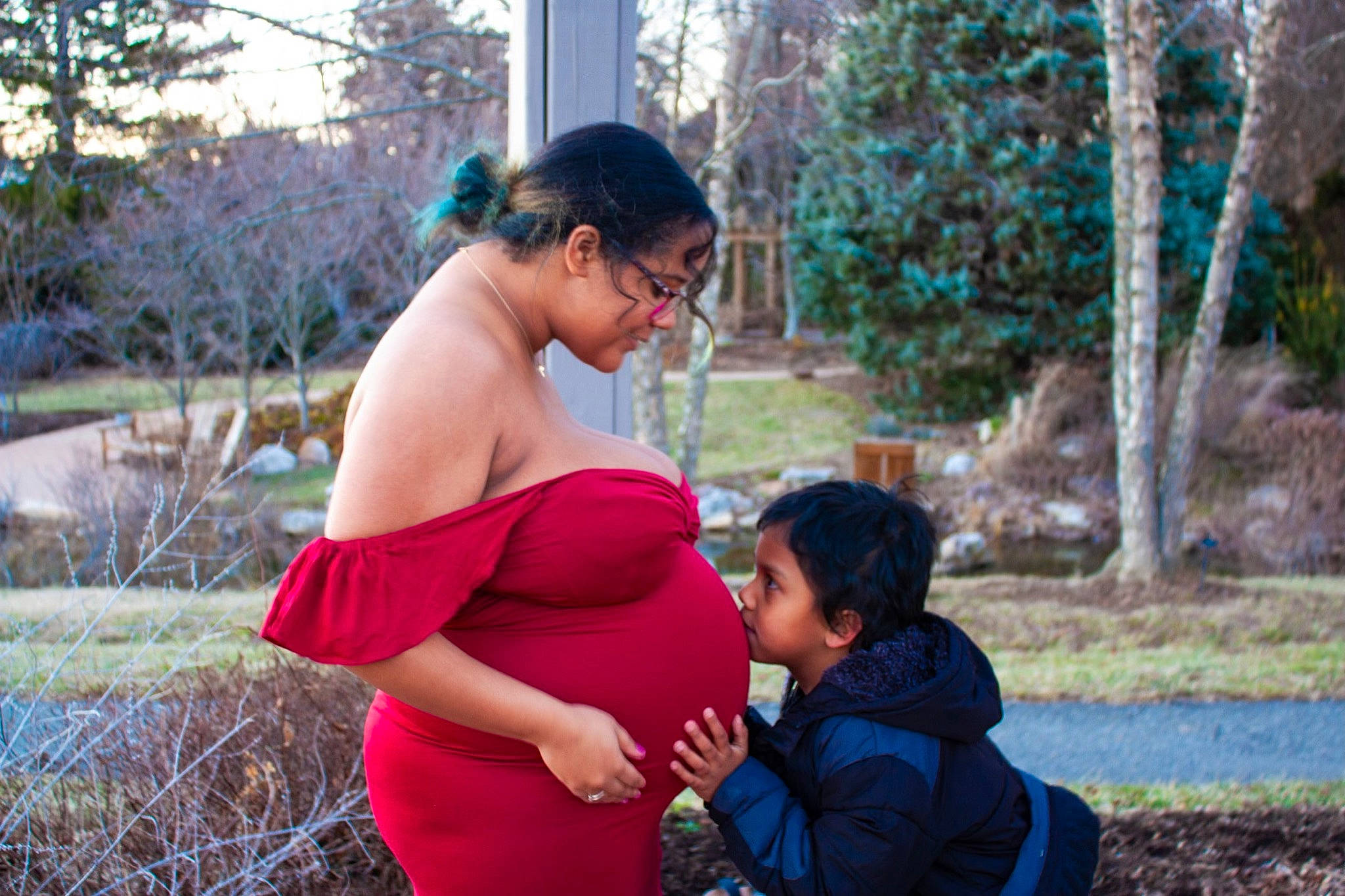 Jonah is registered to the contest to win money with this photo: black_hair, child, electric_blue, event, eyewear, fun, garden, gesture, grass, happy, leisure, magenta, people_in_nature, person, plant, recreation, sitting, t_shirt, toddler, tree