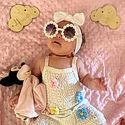 Ilyana participe au concours pour gagner de l'argent avec cette photo : baby, infant, sunglasses, headband, dress, plush_toy, minnie_mouse, blanket, pink, flower, crochet, wooden_sign, milestone, cute, child, smile, lying_down, accessory, soft_toy, portrait