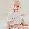 baby, infant, smiling, sitting, white_clothing, blue_eyes, cute, child, portrait, soft_light, quilt, embroidered, happy, innocent, indoor, minimalistic, pale_skin, short_hair, hand, foot