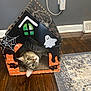 animal, black_cat_graphic, cardboard_house, cat, curious, cute, decor, funny, ghost, halloween, home, indoor, outlet, pet, playing, rug, spider_web, tabby_cat, wall, wooden_floor