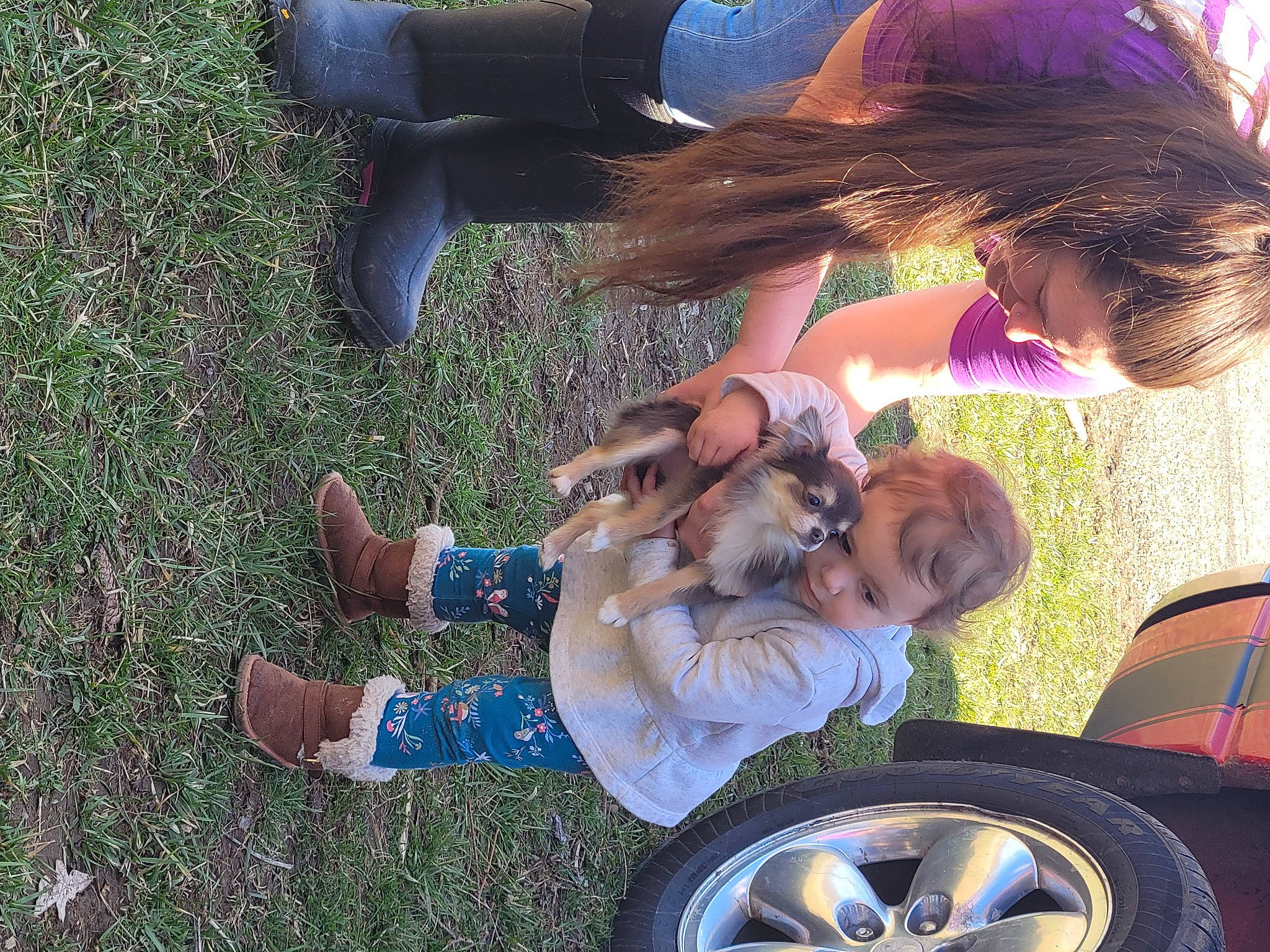 Laylah joined the competition — help win amazing prizes! automotive_exterior, automotive_tire, fender, footwear, grass, happy, hat, leg, motor_vehicle, person, photograph, plant, rim, shoe, snapshot, sneakers, synthetic_rubber, tire, tread, tree