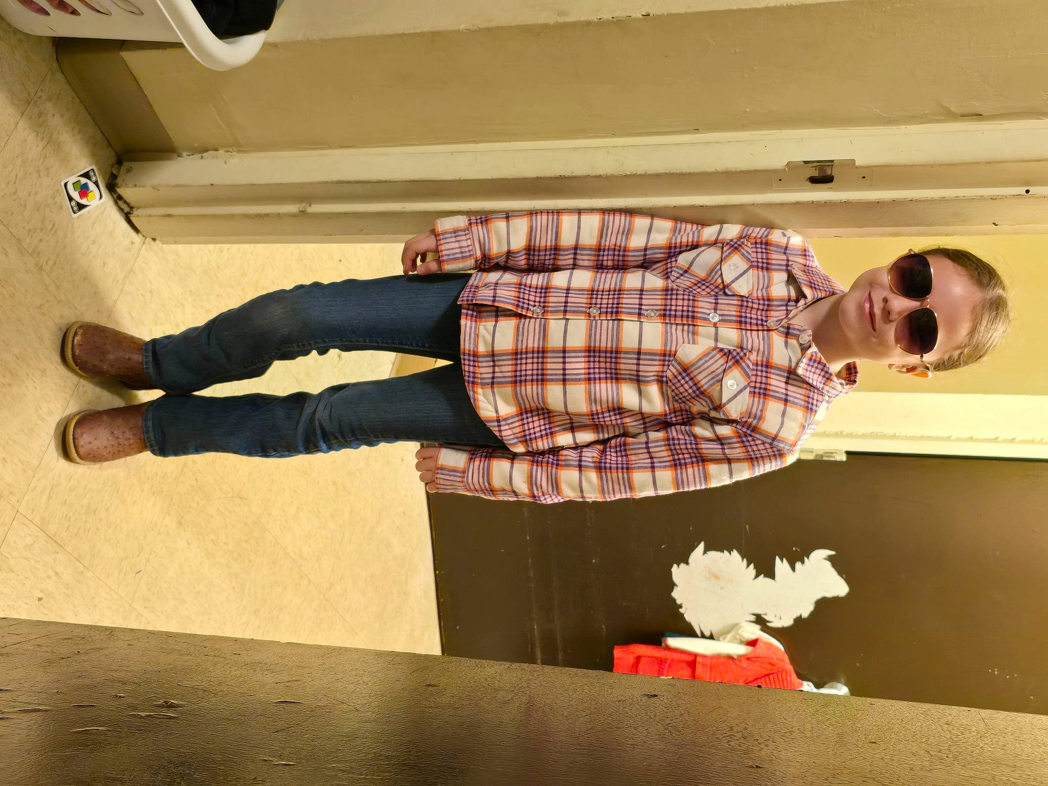 Briella joined the competition — help win amazing prizes! ceiling, eyewear, floor, flooring, fun, human_leg, interior_design, joy, knee, leg, pattern, person, plaid, room, shoe, sportswear, standing, tartan, textile, thigh