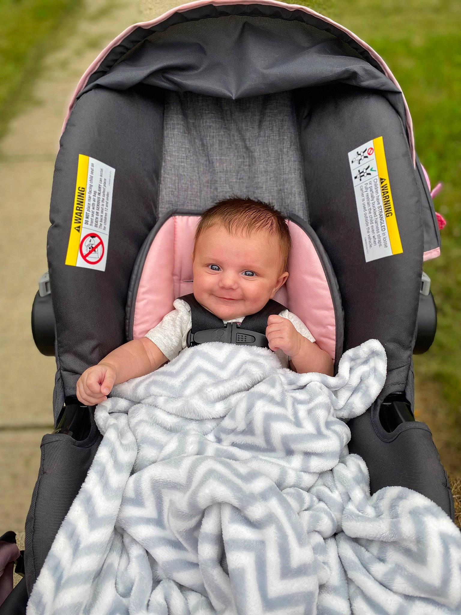 Nevaeh is registered to the contest to win money with this photo: baby, baby_carriage, baby_products, baby_toddler_clothing, bag, car_seat, child, comfort, event, fashion_accessory, fun, grass, happy, joy, leisure, people_in_nature, person, recreation, sitting, smile