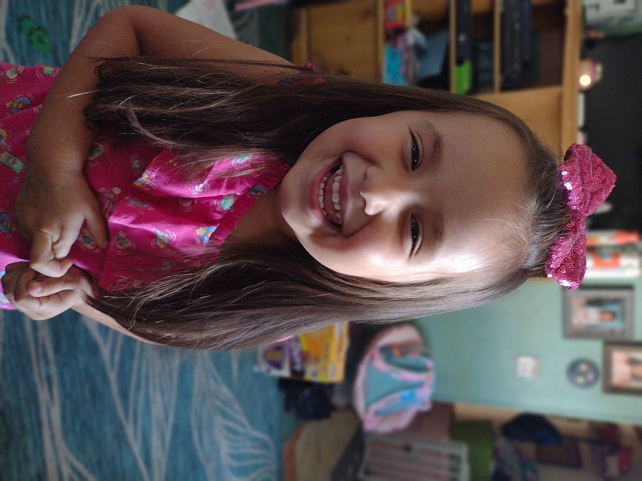 Marilyn is registered to the contest to win money with this photo: black_hair, brown_hair, child, eyebrow, eyelash, facial_expression, feathered_hair, fun, hair_coloring, happy, iris, jaw, joy, leisure, lip, machine, magenta, mouth, person, pink