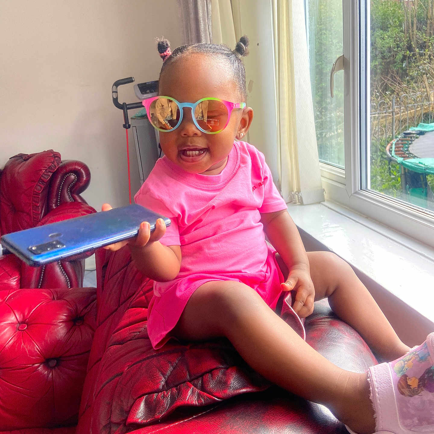 Mali joined the competition — help win amazing prizes! accessories, architecture, building, child, clothing, couch, face, female, furniture, girl, glasses, head, indoors, livingroom, person, photography, portrait, room, sitting, sunglasses