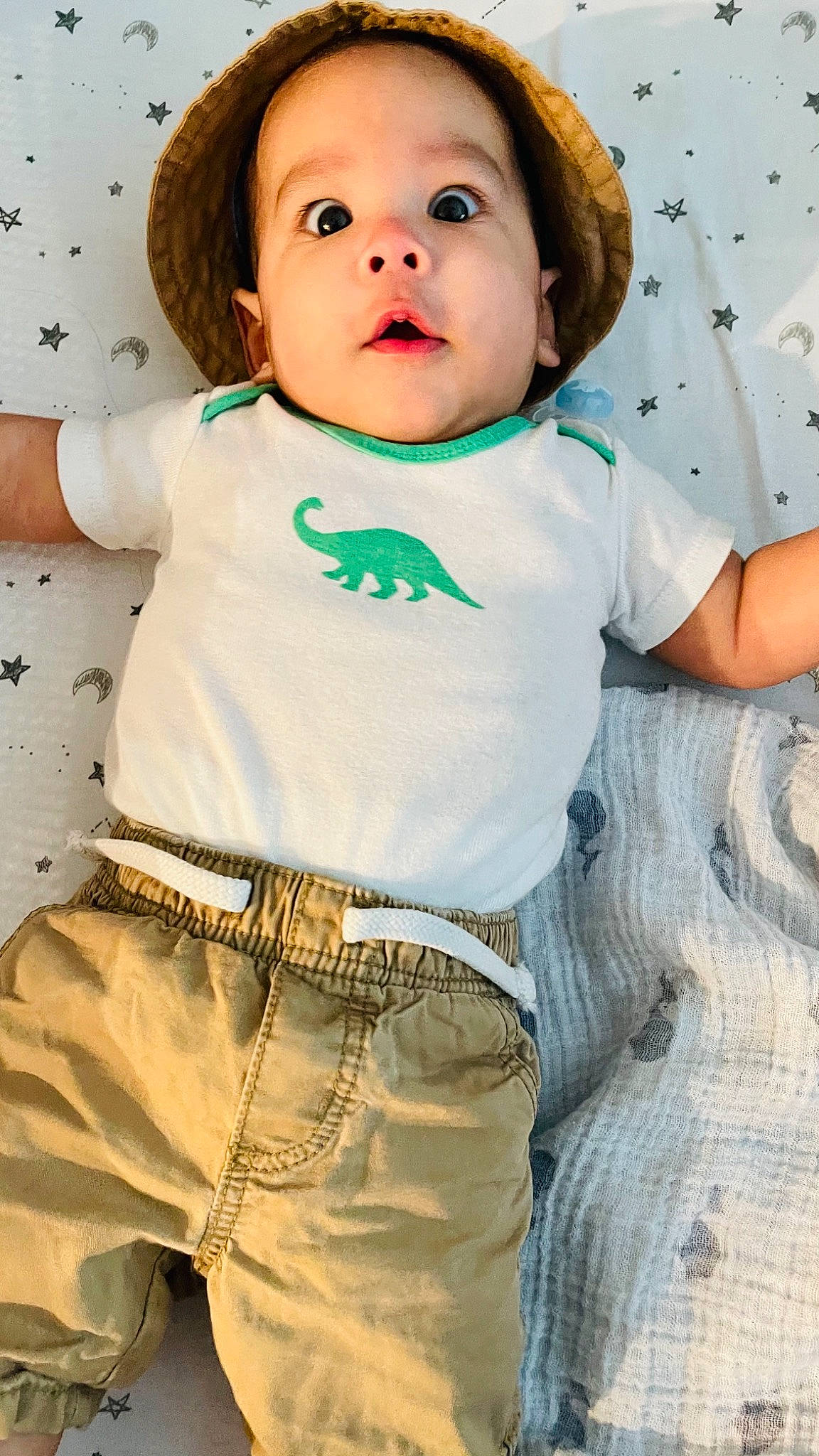 Reid is registered to the contest to win money with this photo: baby_toddler_clothing, cheek, collar, cool, eye, flash_photography, gesture, green, happy, head, human_body, lip, nose, person, photograph, skin, sleeve, standing, surprise, t_shirt