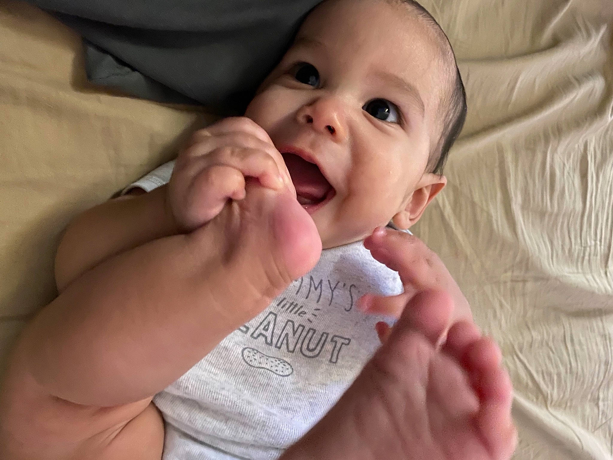 Reid is registered to the contest to win money with this photo: baby, baby_toddler_clothing, cheek, comfort, eye, eyebrow, eyelash, finger, fun, gesture, happy, iris, lip, nail, nose, person, skin, sleeve, smile, thumb