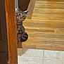 cat, tabby, pet, peeking, doorframe, hardwood_floor, tile_floor, collar, curious, indoor, home, wood, floor, whiskers, ears, sitting, wide_eyes, cute, portrait, domestic_animal